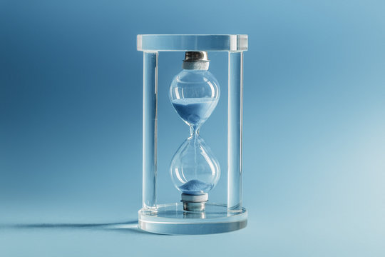 Hourglass on blue background