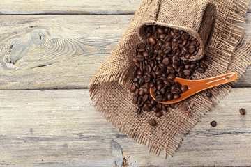 Roasted coffee beans on a wooden floor