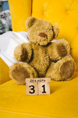 Teddy bear and wooden calendar