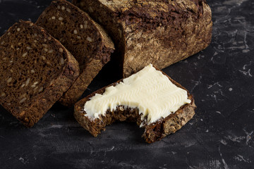 Rye bread on dark board background