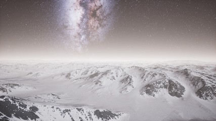 aerial view of Milky Way above snow covered terrain
