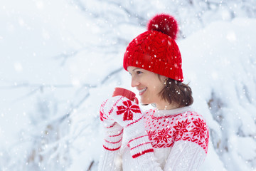 Woman drinks Christmas chocolate. Girl with cocoa.