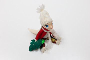 Cute toy - a hare doll in clothes (hat, jacket) made of fabric