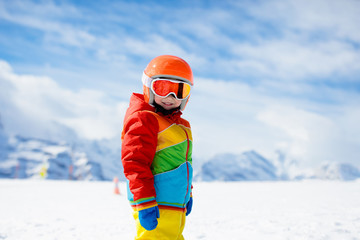 Ski and snow winter fun for kids. Children skiing.