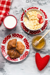 Cereal, honey for breakfast with red knitted heart