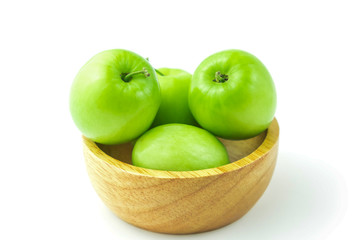 apple monkey or jujub (Zizyphus mauritiana Lam) isolated green fruit in wooden cup on white background and clipping path.