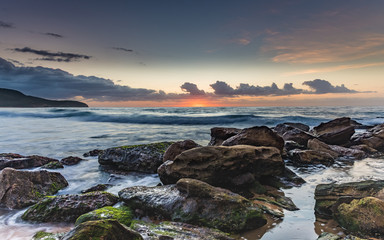 Fototapeta na wymiar Rocky Sunrise Seascape