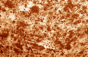 Part of old ceramic plate close-up in orange tone.