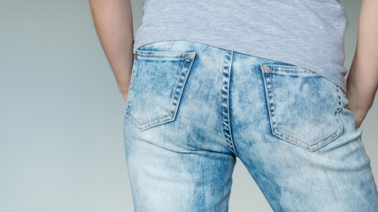 man butt in jeans. nice buttocks in blue denim. male fashion