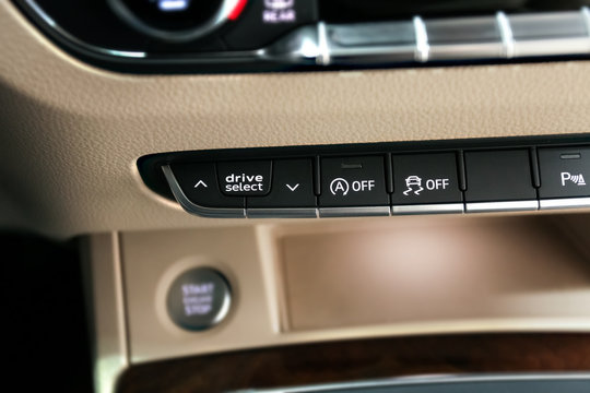 Drive select button on a car, beige