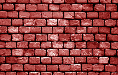 Old grungy brick wall surface in red tone.