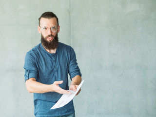 dissatisfied man pointing to documents. mistake in business paperwork