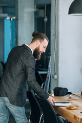 man multitasking talking on the phone and checking with notepad. successful business man lifestyle