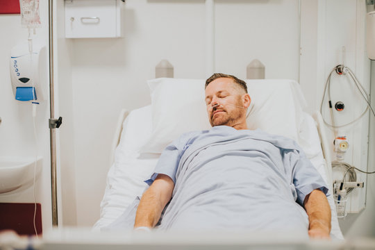 Sick man in a hospital bed