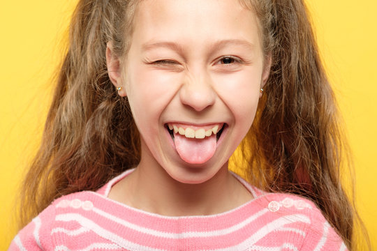 Out woman sticking tongue Senior woman
