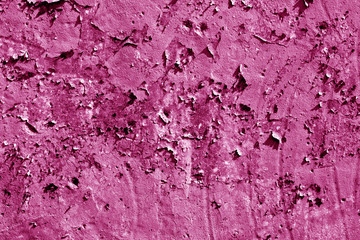 Grungy cement wall texture in pink tone.