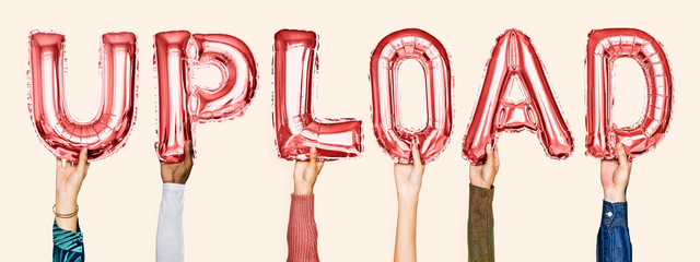 Red alphabet helium balloons forming the text upload