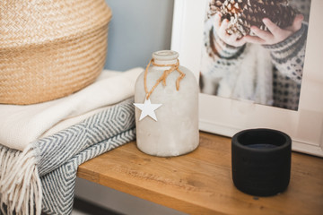 Still life details of nordic living room. Home interior decor in gray and brown colors