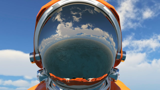 reflection in the helmet of an astronaut falling to the Earth, aerial view