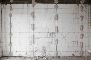 Preparing walls for plastering house  walls with metal holders interior.