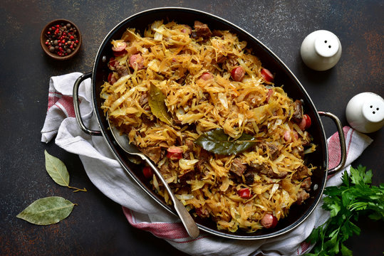 Bigos - cabbage stewed with meat, dried mushrooms and sausage.Traditional dish of polish cuisine.Top view with copy space.