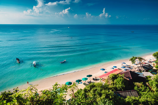 Tropical beach with boats and blue ocean in tropical island