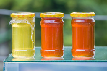 Banks with different kinds of honey in the market