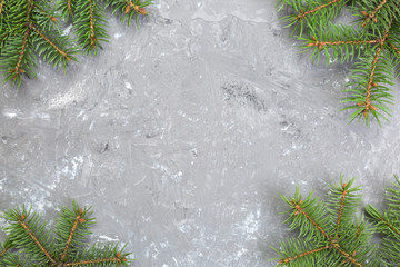 Christmas gray cement background with fir tree and copy space. top view empty space for your design
