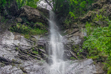 Fototapeta na wymiar Beautiful waterfall in Caucasus mountains in Adjara, Georgia