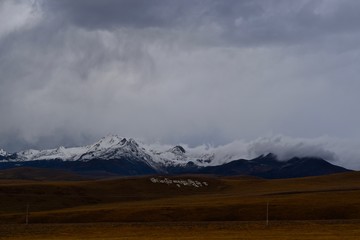 Grassland and mountains on the way to Tagong at around 4100 meters above the sea level, Sichuan, China