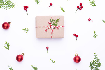 Christmas background concept. Top view of Christmas gift box red sock with spruce branches, pine cones, red berries and bell on white background.