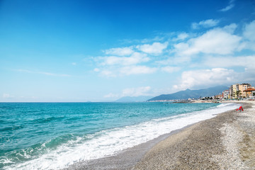 Pebble beach and blue sky on background