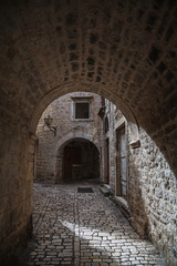 Beautiful view from tunnel in old city all made of dolomite stones
