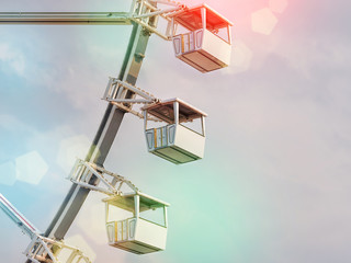 Low angle view of ferris wheel cabins.