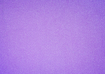 Pinkish and purple glitter full frame textured shiny abstract background with vignetting.