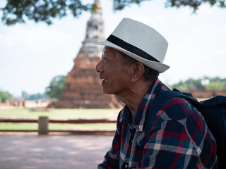 Face of Senior man Asian happy and smiling, talk of tourist.  Travel, holiday and lifestyle Concept.