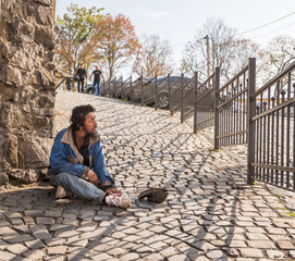 Fototapeta premium Homeless man on the street of the city