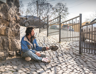 Fototapeta na wymiar Homeless man on the street of the city