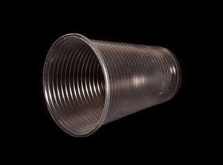 disposable glass isolated on black background