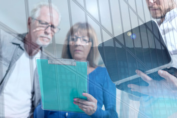 Coworkers having a business discussion, double exposure