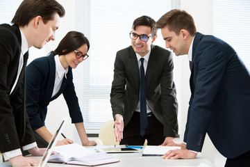 Businesspeople discuss a new project