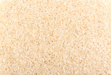 Long grain rice as background. Rice texture