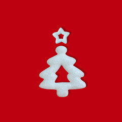 White glitter Christmas tree on red background, Seasons Greeting, Minimal New Year concept.