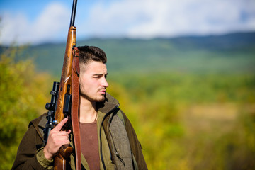 Man hunter carry rifle nature background. Experience and practice lends success hunting. Guy hunting nature environment. Masculine hobby activity. Hunting season. Hunting weapon gun or rifle