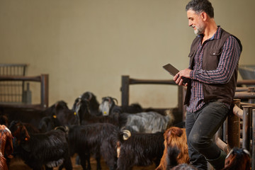 Adult Farmer with Tablet