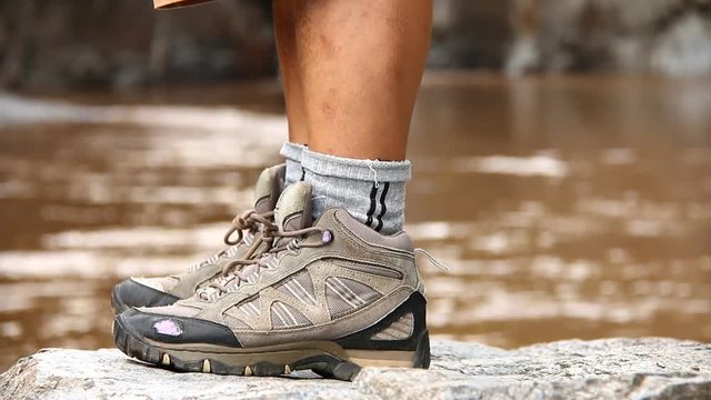 Hiking shoes with head stream background, Chiangmai Thailand
