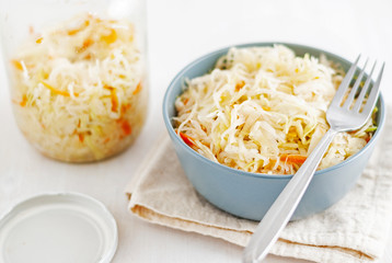 Jar and bowl with sauerkraut