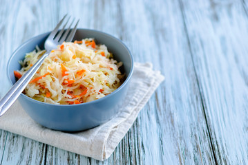 Bowl with sauerkraut standing on table