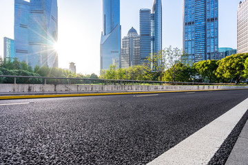 city skyline with empty asphalt road