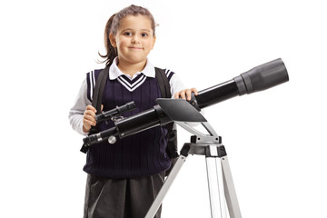 Little schoolgirl with a telescope